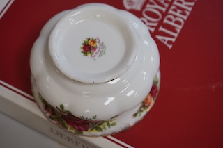 A Royal Albert Old Country Roses part tea set comprising twelve trios, a two tier cake stand, sugar bowl and cream jug. Condition - good